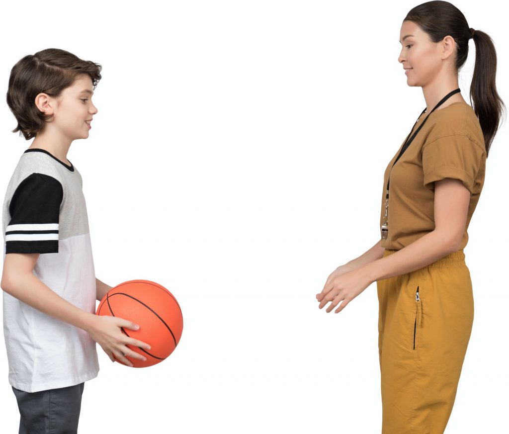 two young girls playing with a basketball
